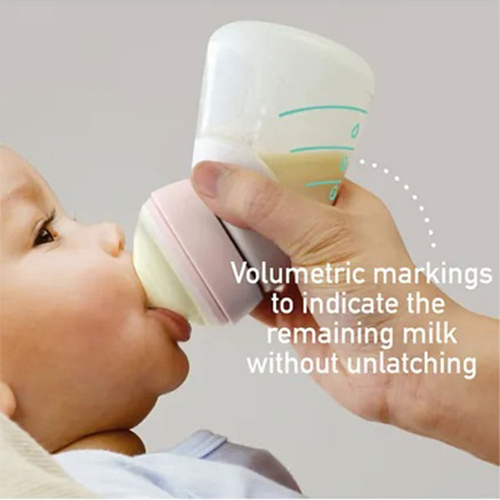 Marcus N Marcus  Silicone Angled Feeding Bottle And Spoon Set  Peach