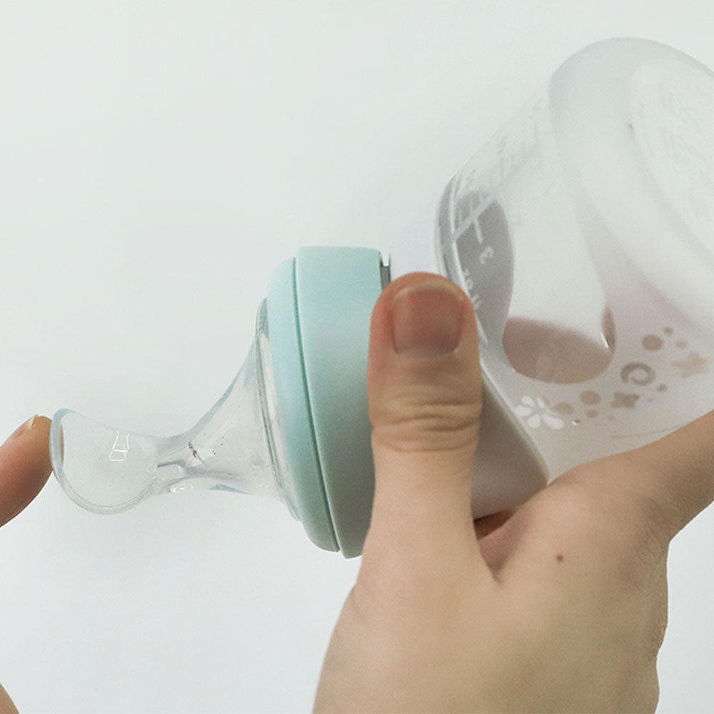 Marcus N Marcus  Silicone Angled Feeding Bottle And Spoon Set  Peach